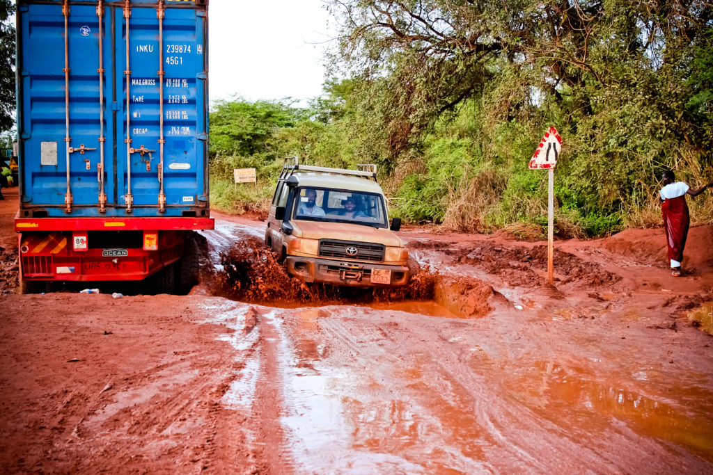 Every Village team driving on muddy roads in Mvolo, South Sudan