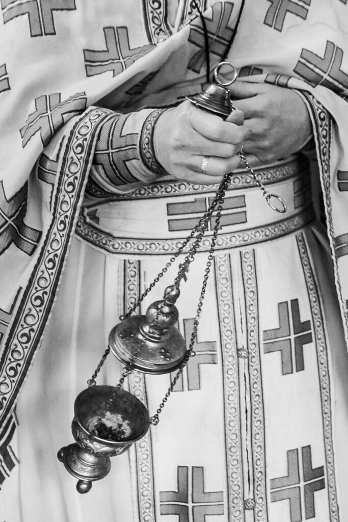 Priest censing the church before an Eastern Orthodox baptism