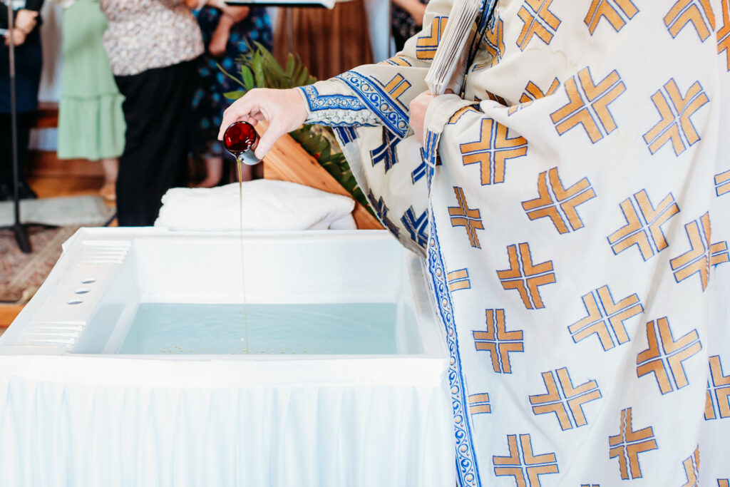 Preparing the baptismal font in an Eastern Orthodox Church